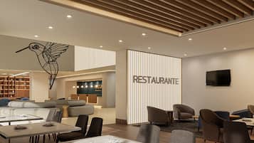 A modern restaurant interior with a dining area, sofas, and a wall-mounted TV.