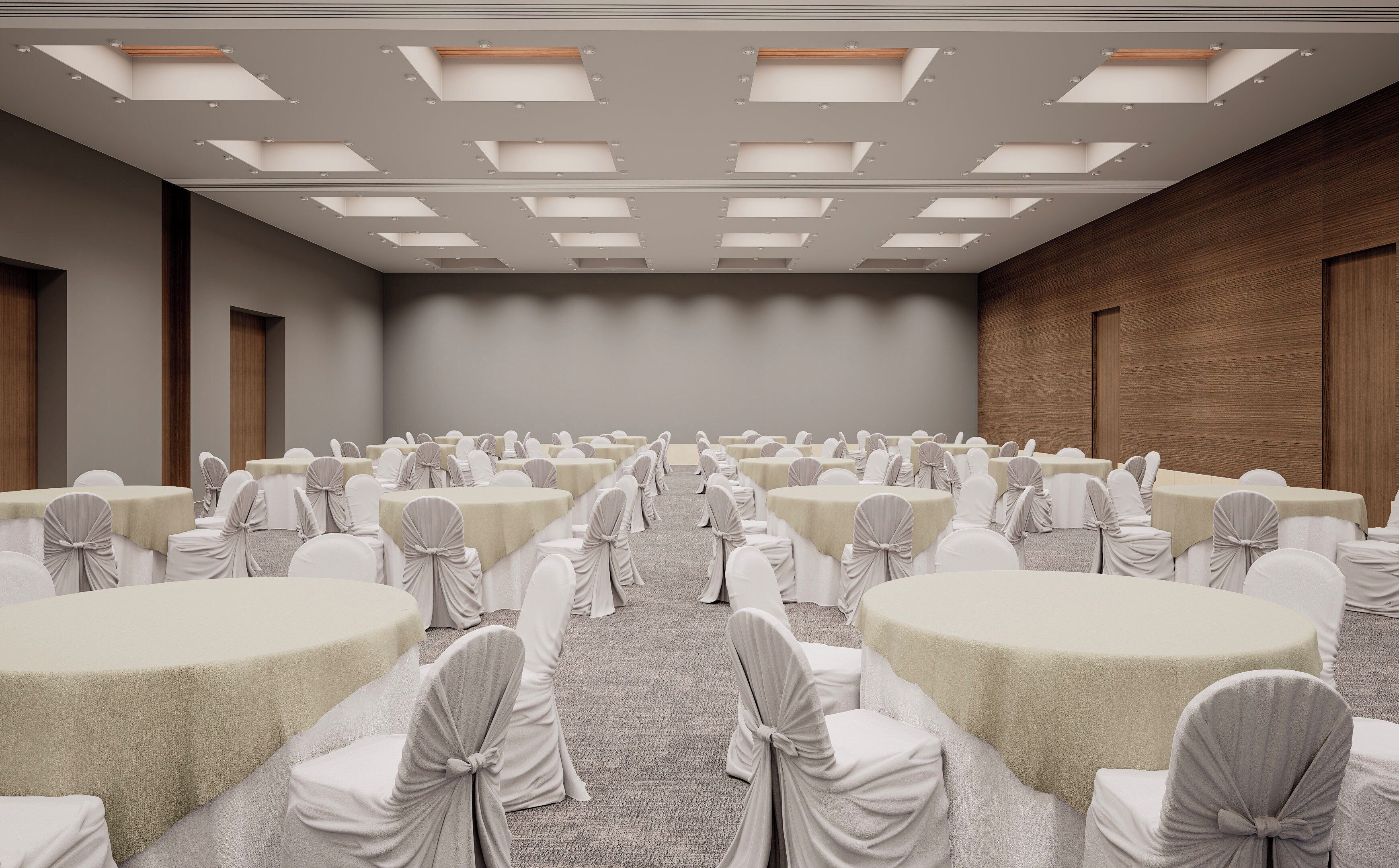 A conference room with multiple tables and chairs, arranged in rows.