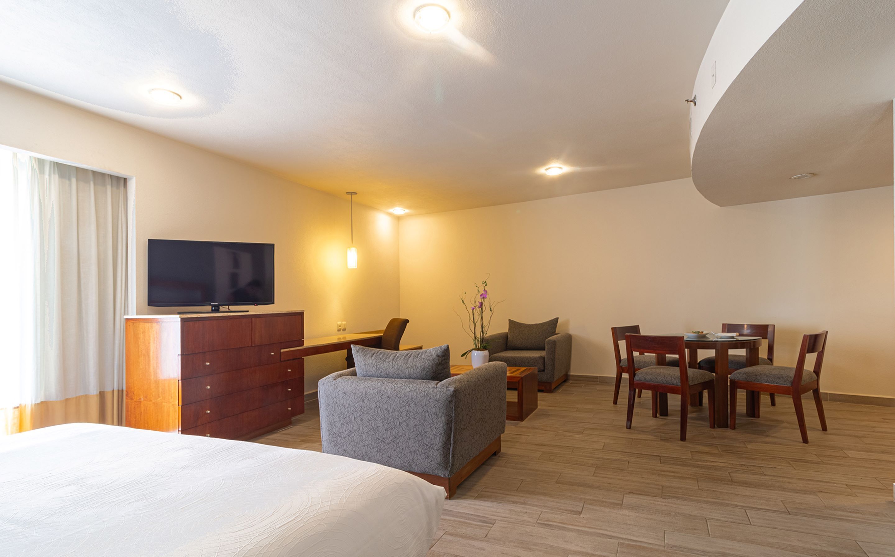 junior suite | in-room safe, desk, blackout curtains, iron/ironing board