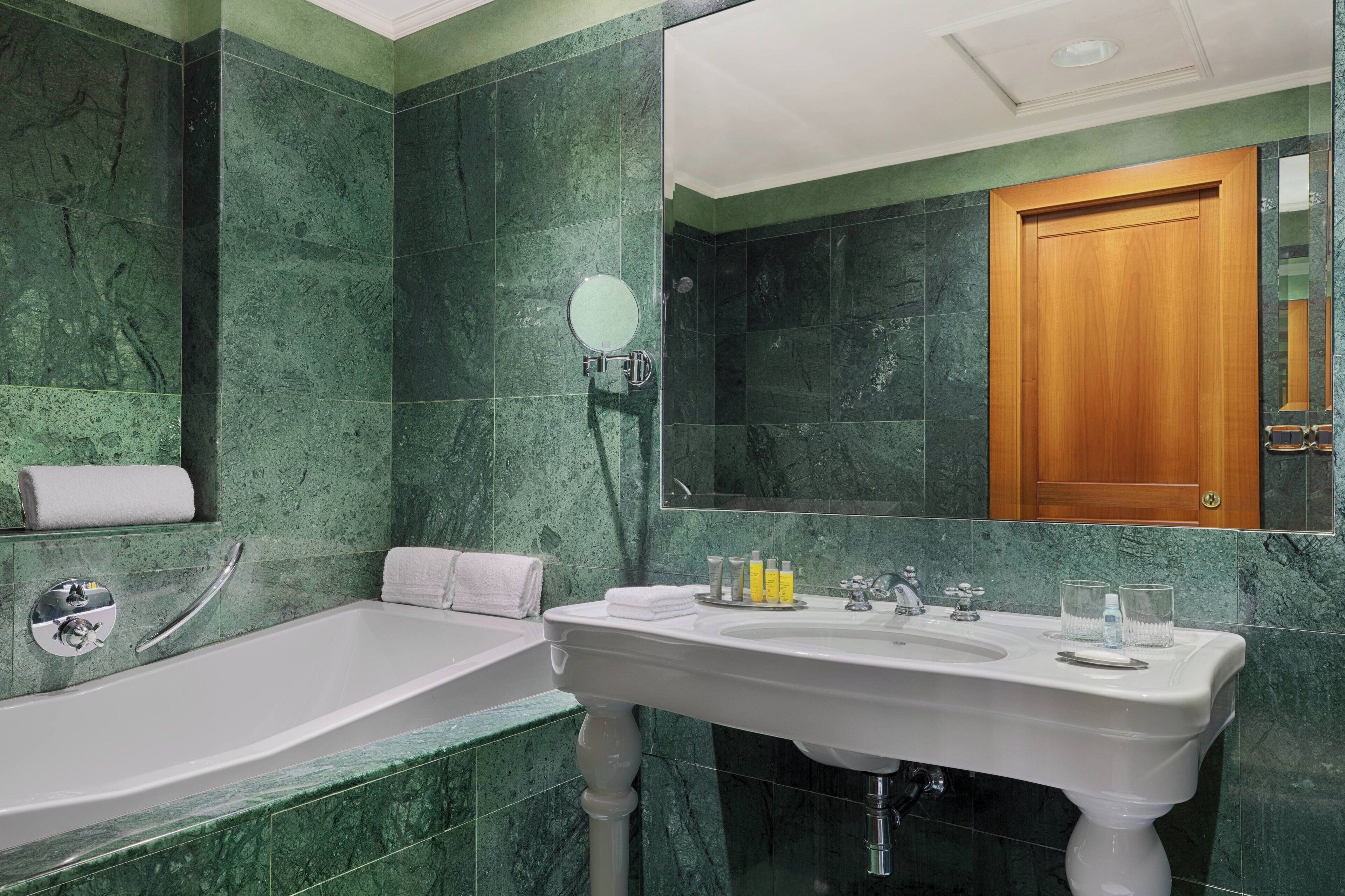 executive suite, 1 bedroom | bathroom | combined shower/bathtub, rainfall showerhead, free toiletries