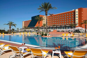 Seasonal outdoor pool, open 9:30 AM to 8:30 PM, pool umbrellas
