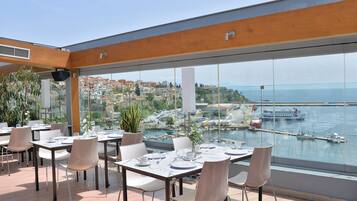 Breakfast, lunch, dinner served; Mediterranean cuisine, ocean views