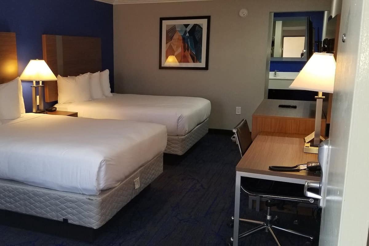 Premium bedding, pillowtop beds, desk, laptop workspace