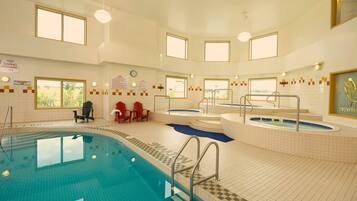Indoor pool, open 9:30 AM to 11:00 PM, pool loungers