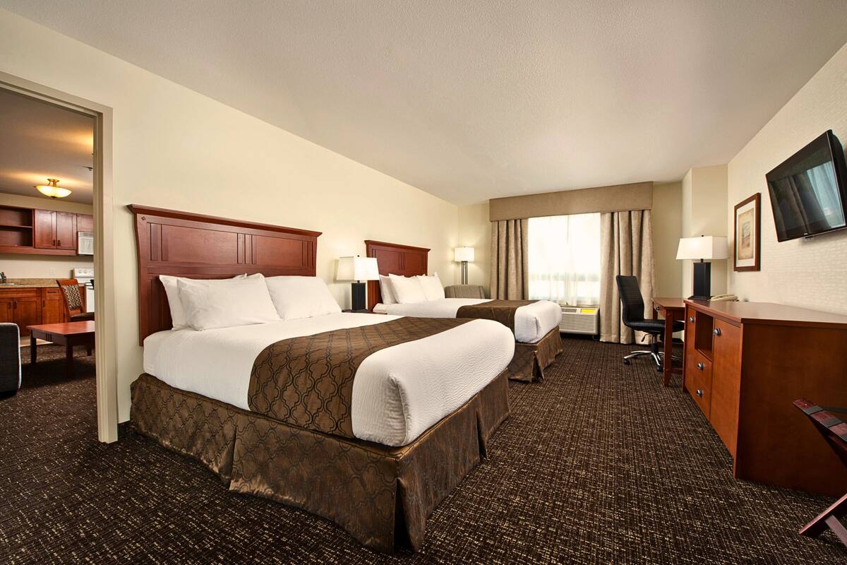 premium bedding, pillow-top beds, desk, laptop workspace