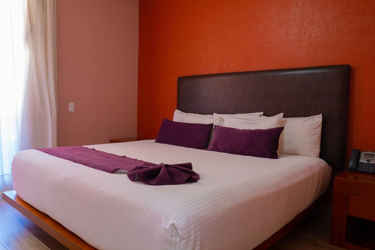 junior room, 1 king bed | in-room safe, blackout curtains, soundproofing, iron/ironing board