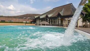 Relax by the pool with a soothing water fountain display.