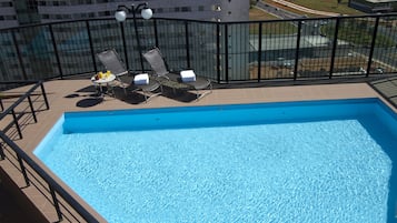 Outdoor pool, open 8:00 AM to 8:00 PM, sun loungers