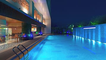 Outdoor pool, open 7:00 AM to 11 PM, pool umbrellas, pool loungers