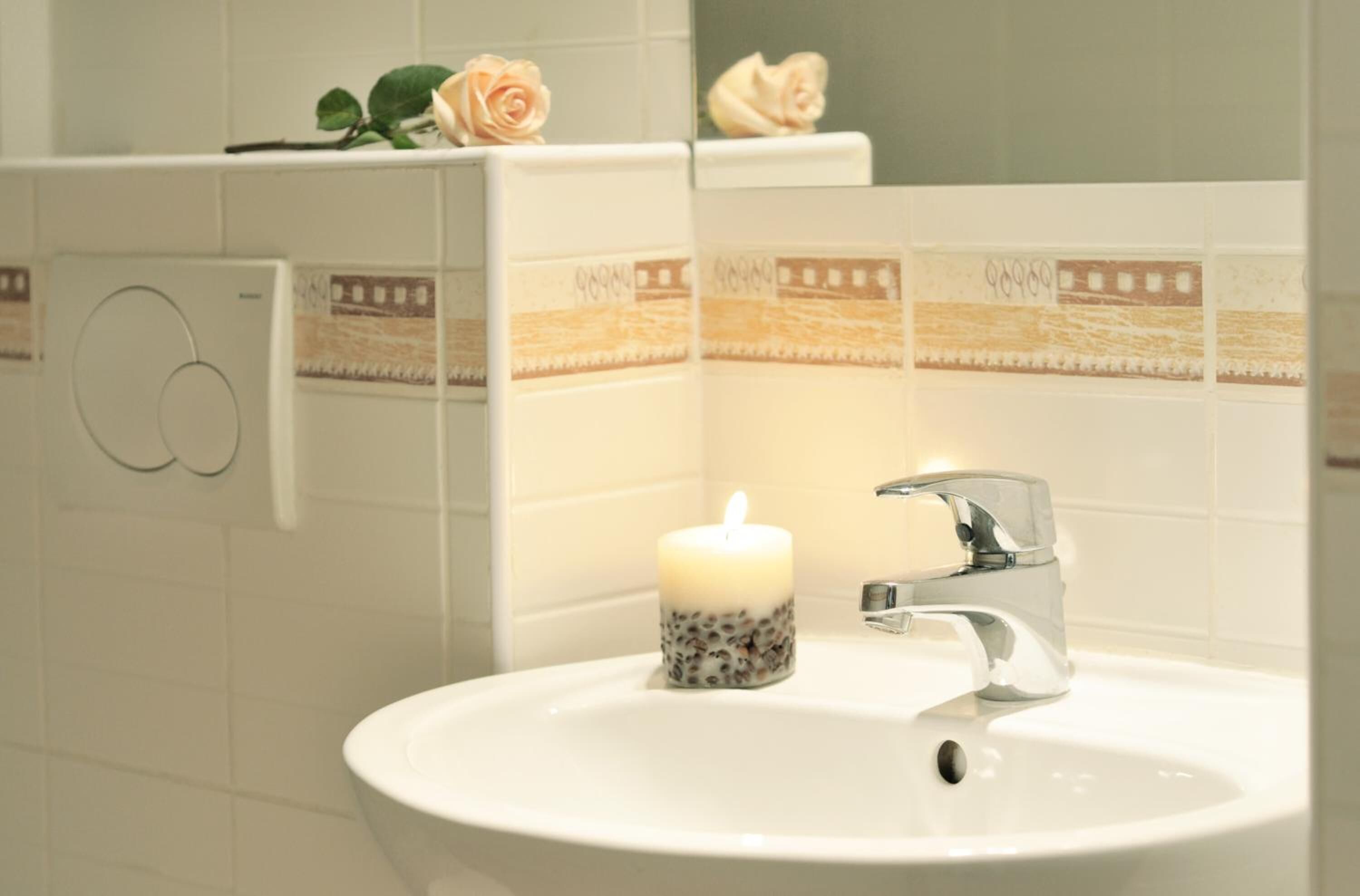 shower, hair dryer, towels, toilet paper