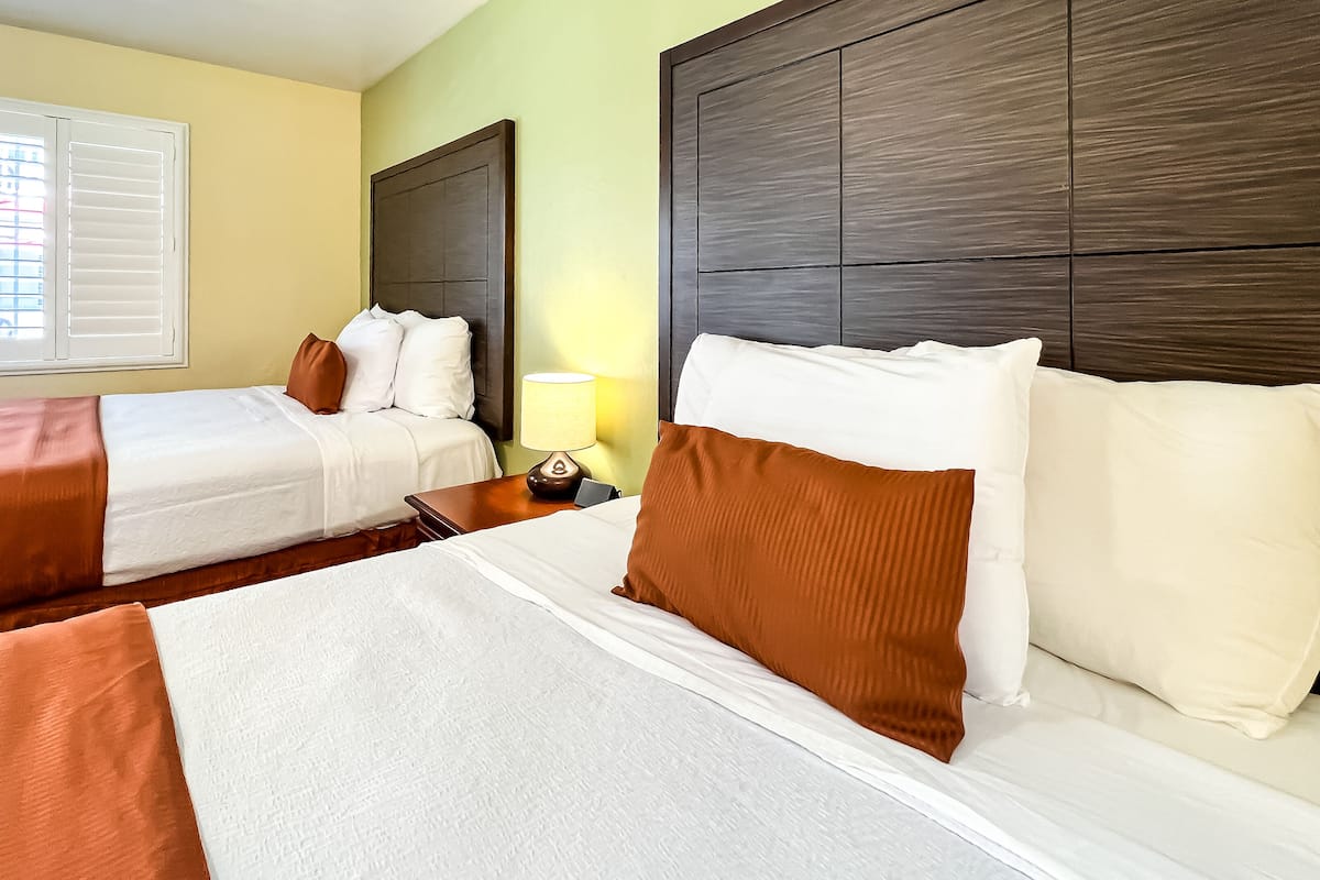 standard room, 2 queen beds, non smoking | individually decorated, desk, iron/ironing board, free wifi