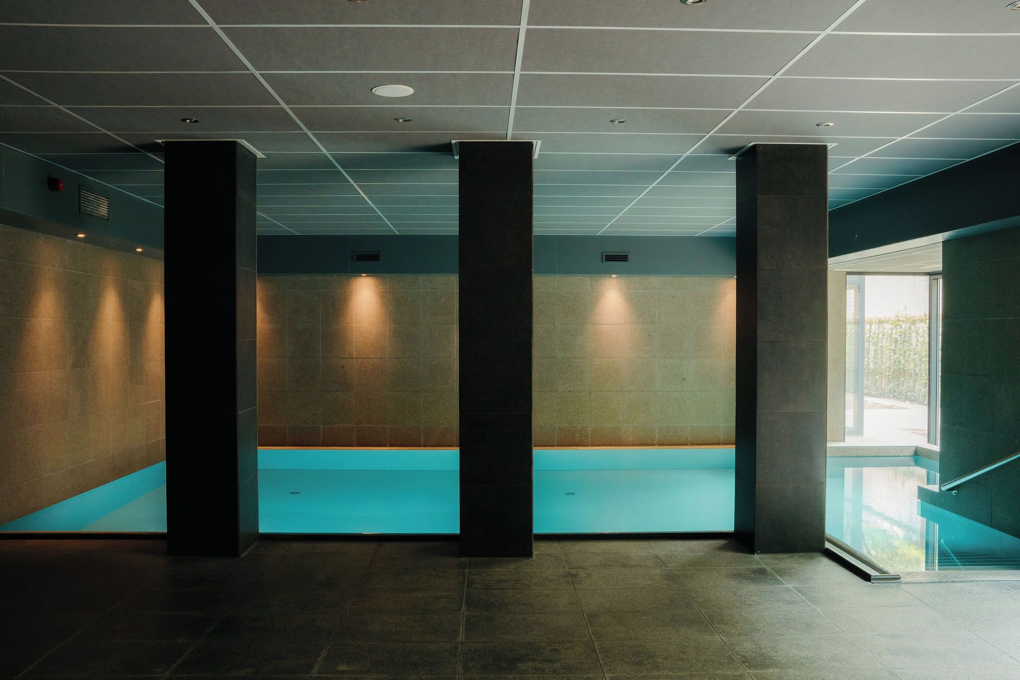 Indoor pool, open 7:00 AM to 11:00 PM, pool loungers
