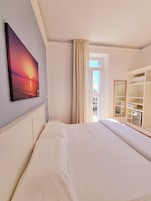 Superior Room, Balcony, Bay View | Minibar, in-room safe, desk, laptop workspace