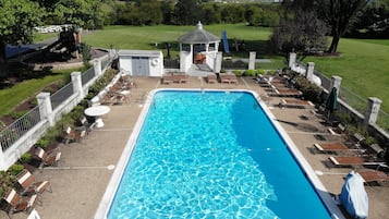 Outdoor pool, open 9:00 AM to 9:00 PM, pool umbrellas