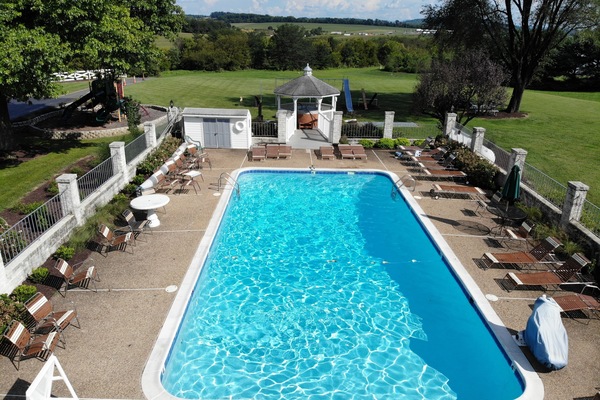 Outdoor pool, open 9:00 AM to 9:00 PM, pool umbrellas