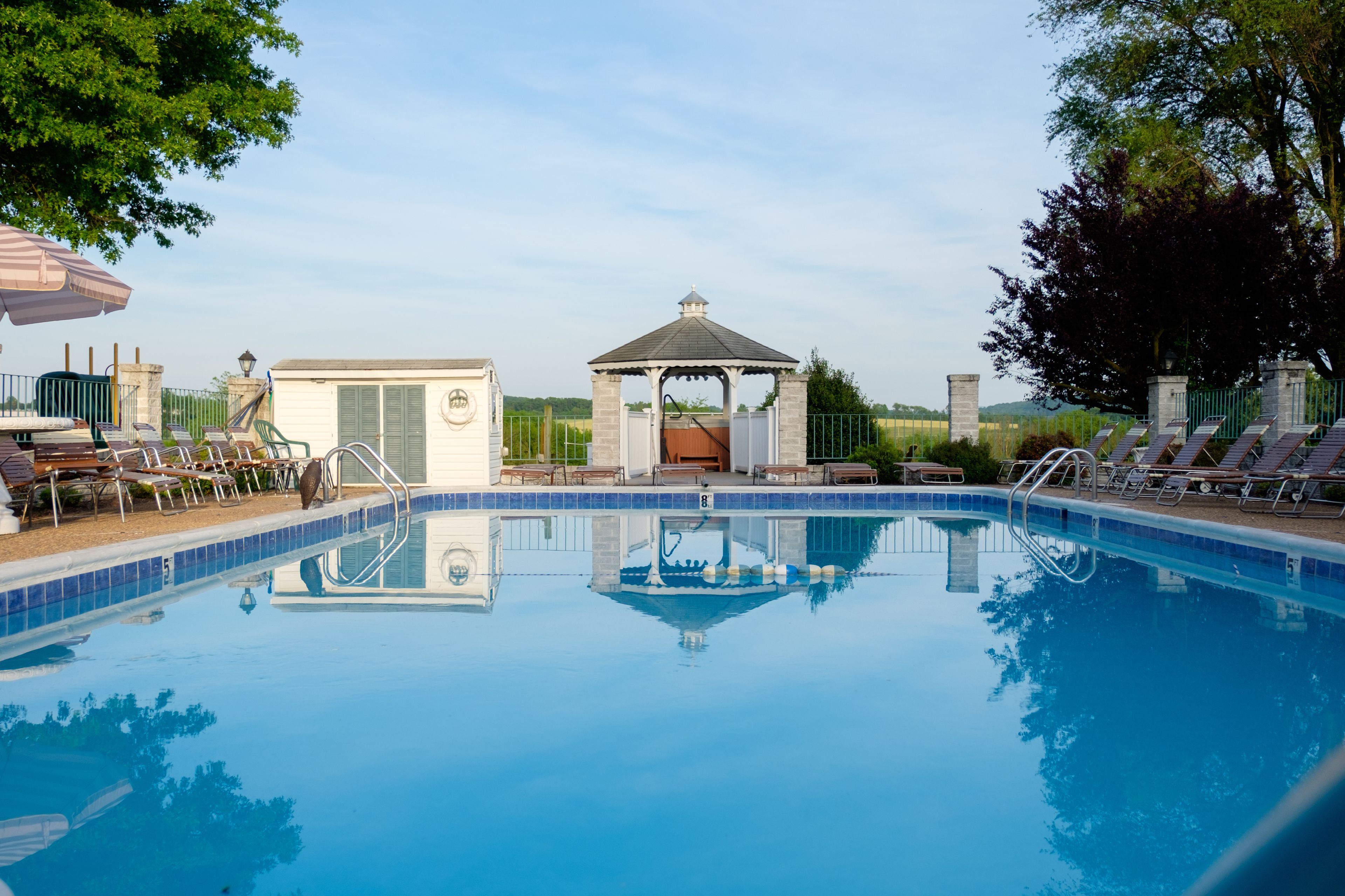 Outdoor pool, open 9:00 AM to 9:00 PM, pool umbrellas