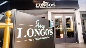 A storefront with a sign reading "Jerry Longo's meatballs & martinis."