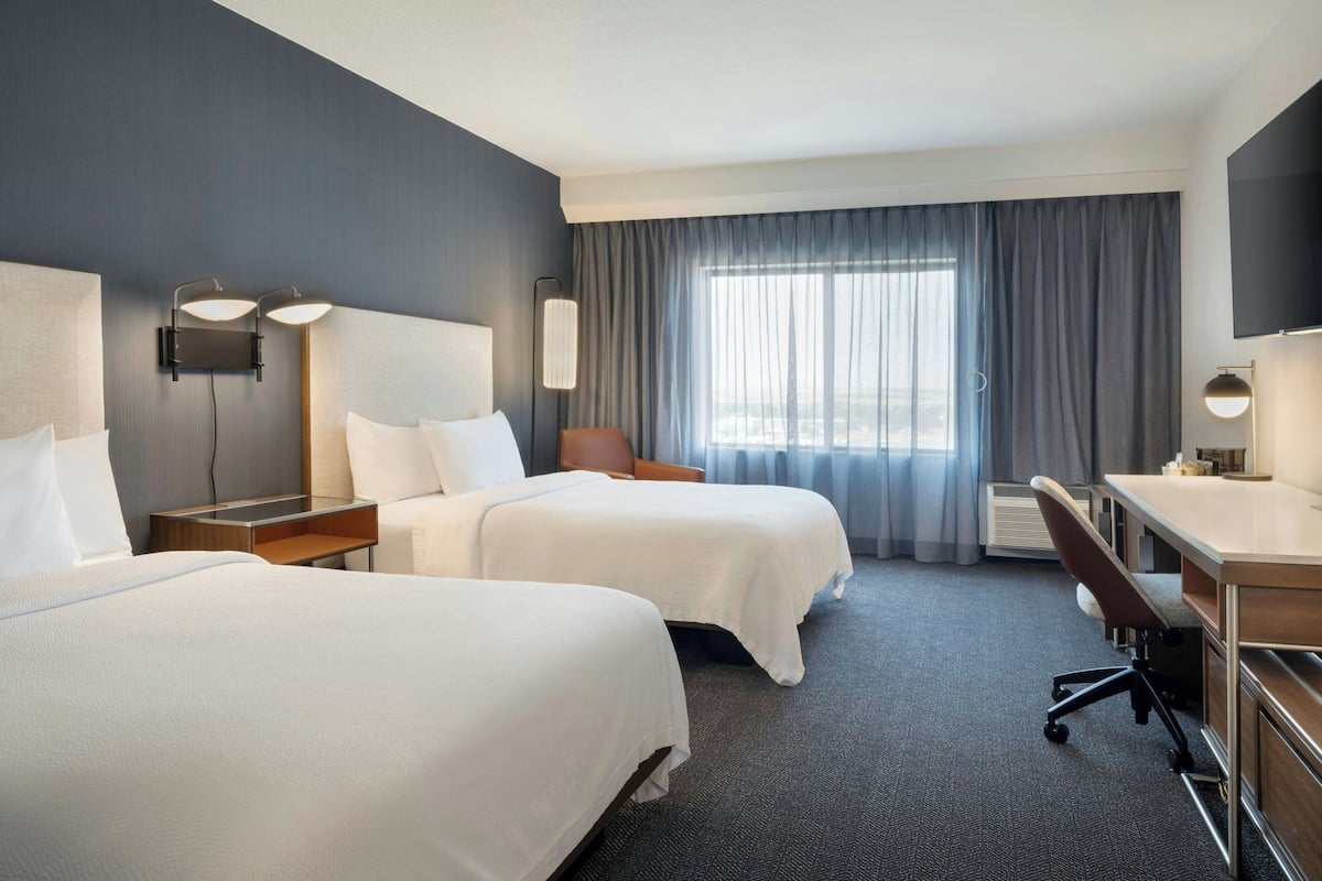 Pillowtop beds, desk, laptop workspace, blackout drapes