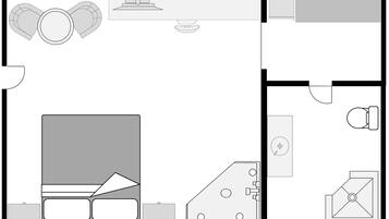 Indeling van een hotelkamer, met een bed, bureau, stoel en badkamer.