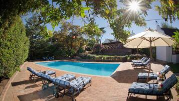 Outdoor pool, pool umbrellas, pool loungers