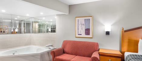 Camas con pillow-top, escritorio y tabla de planchar con plancha