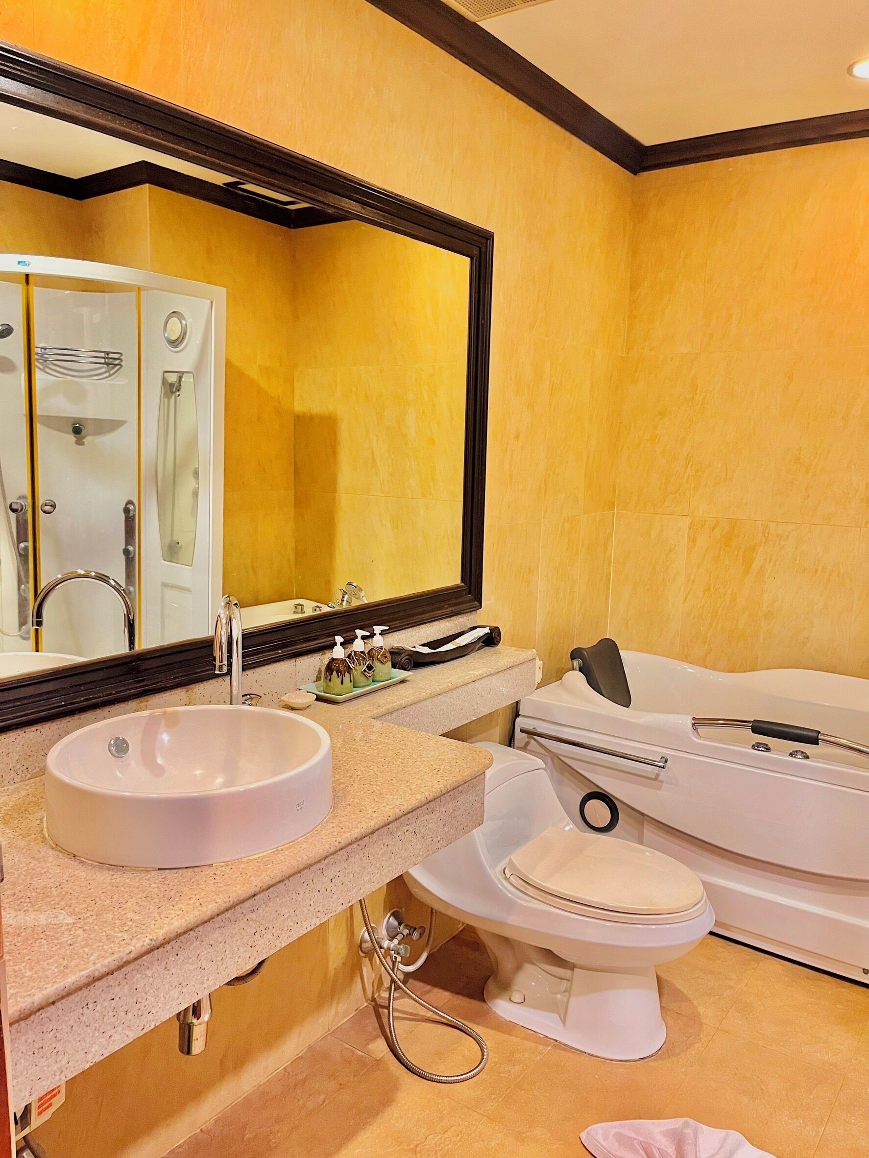 A bathroom with a sink, toilet, and bathtub.