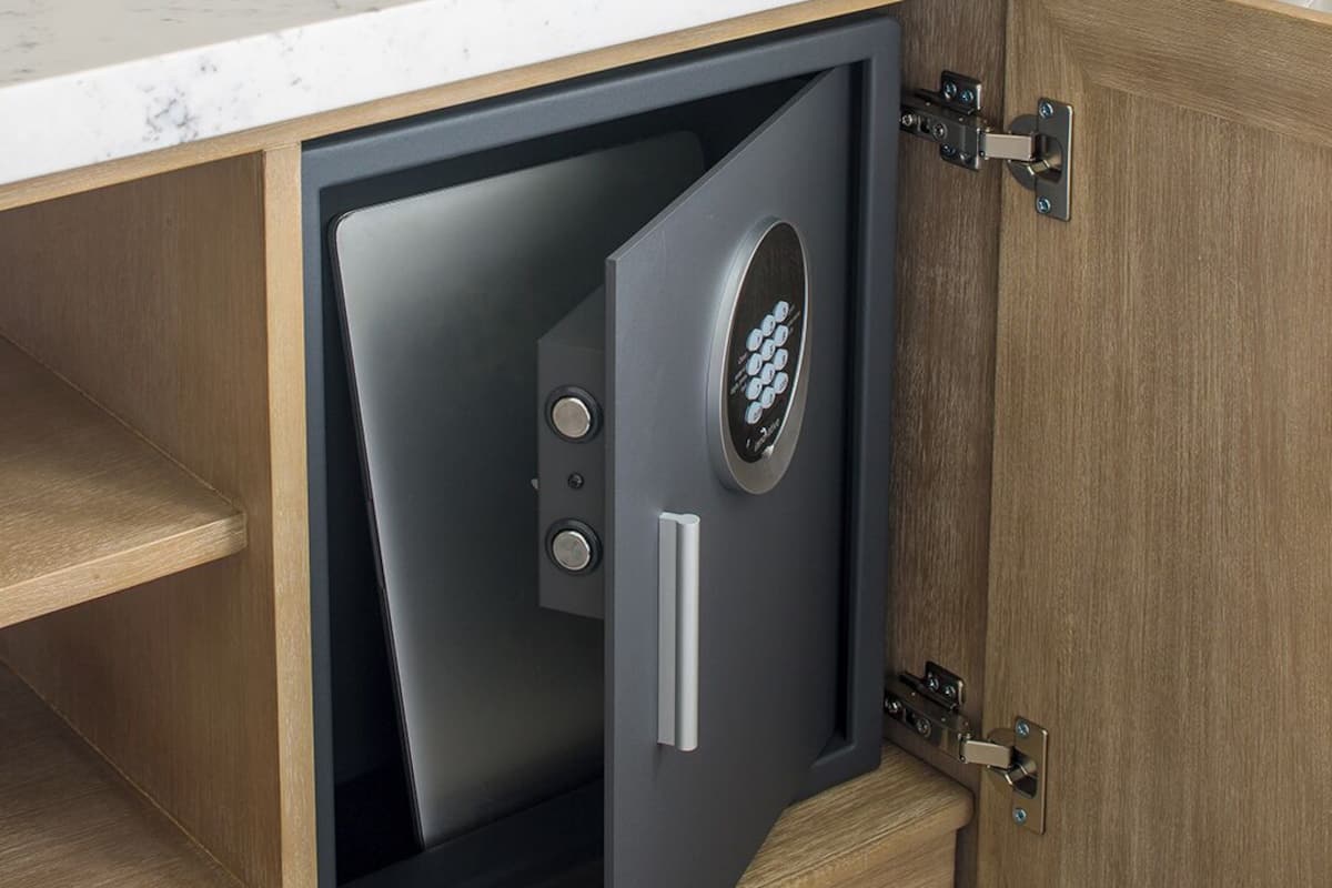 A wooden cabinet with a built-in safe.