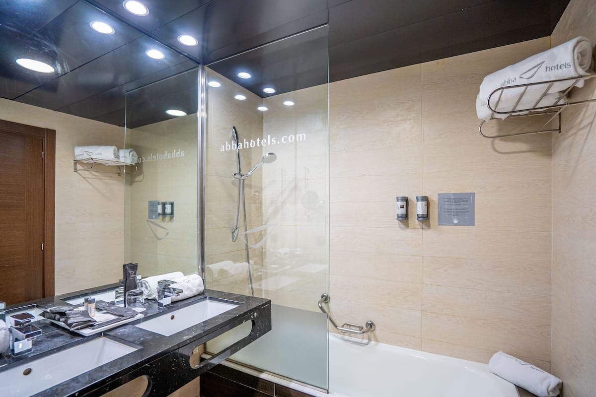 eco-friendly toiletries, hair dryer, towels, soap