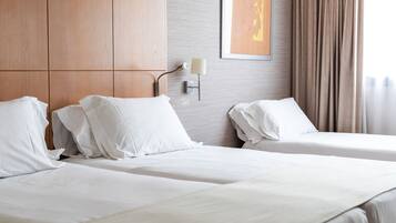 Triple Room (2 adults + 1 child) | Minibar, in-room safe, desk, blackout drapes