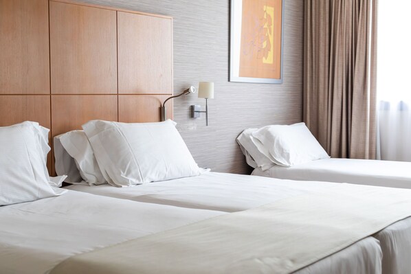 Triple Room (2 adults + 1 child) | Minibar, in-room safe, desk, blackout curtains