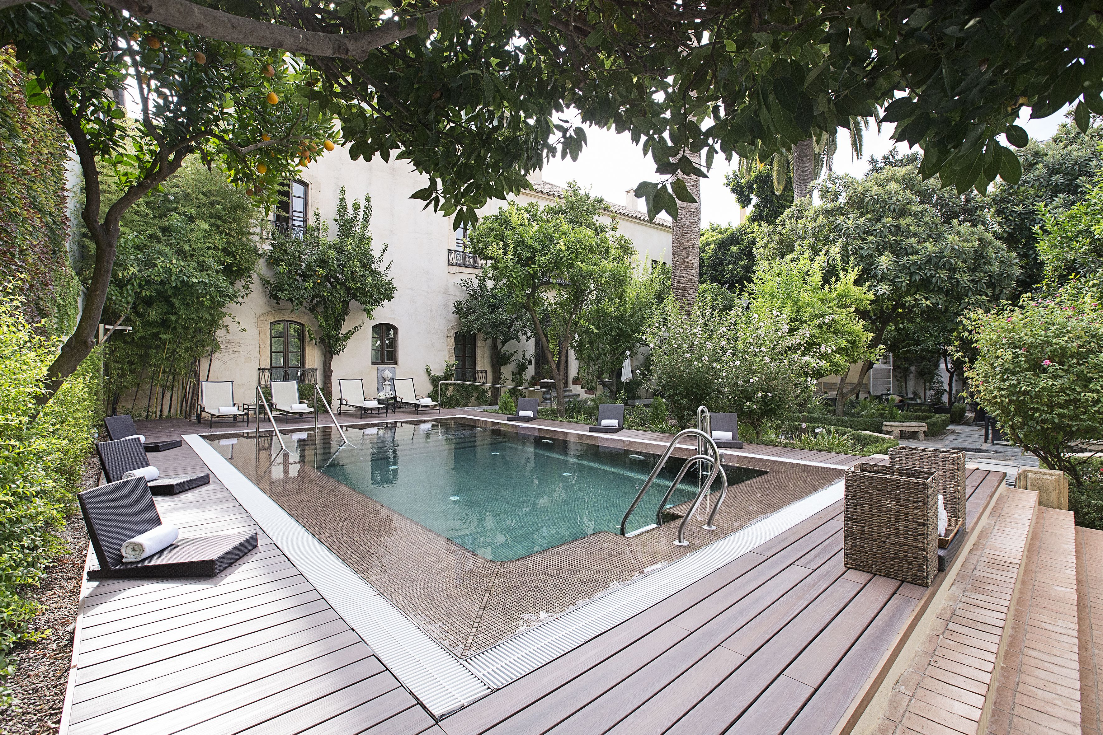 outdoor pool, open 10:00 am to 8:00 pm, pool umbrellas, pool loungers