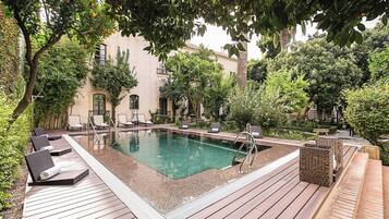 Outdoor pool, open 10:00 AM to 8:00 PM, pool umbrellas, sun loungers