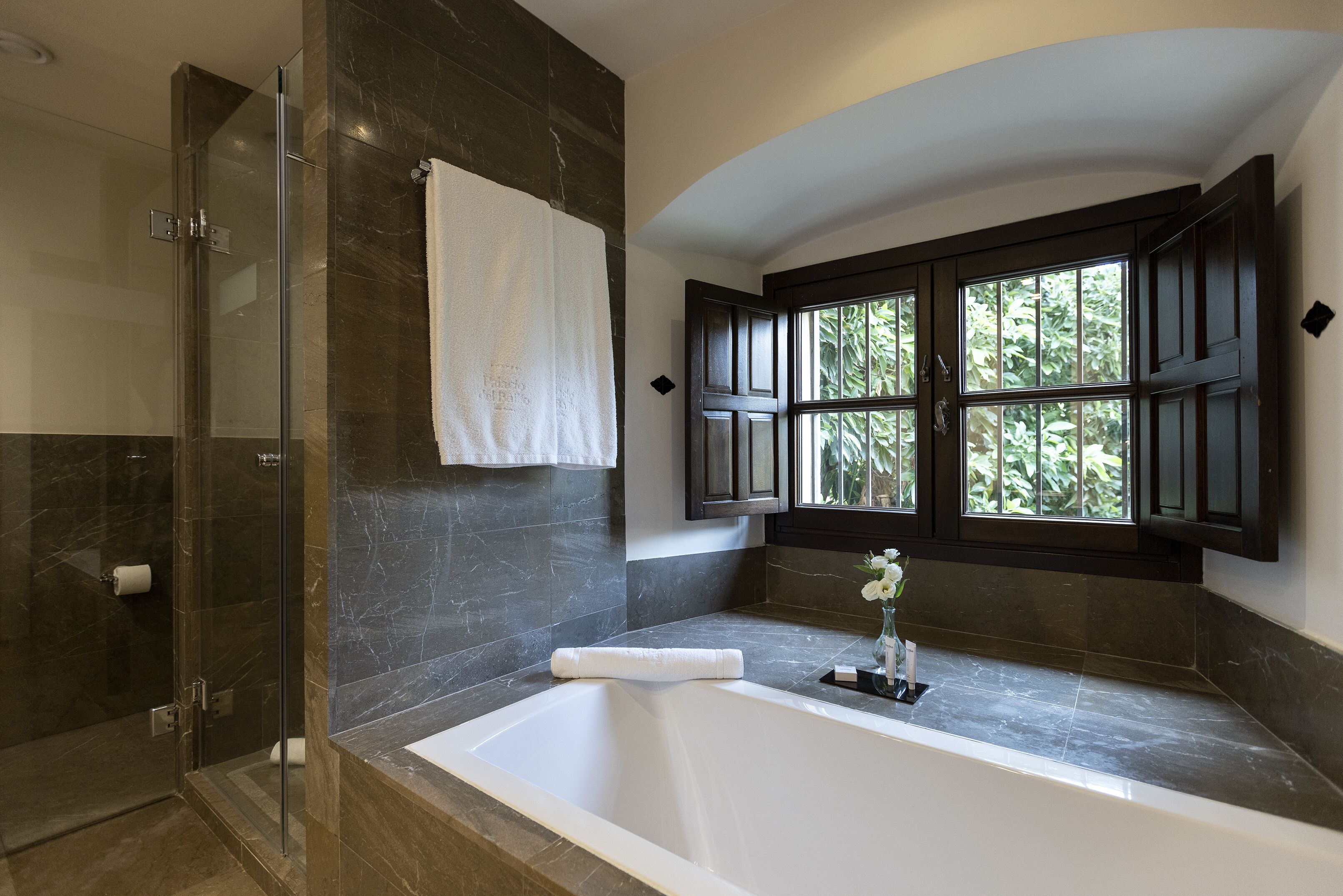 separate bathtub and shower, rainfall showerhead, designer toiletries