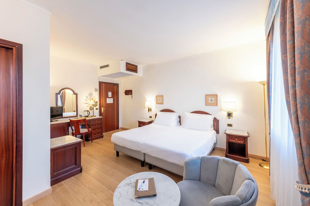 Junior Suite | 1 bedroom, premium bedding, minibar, in-room safe