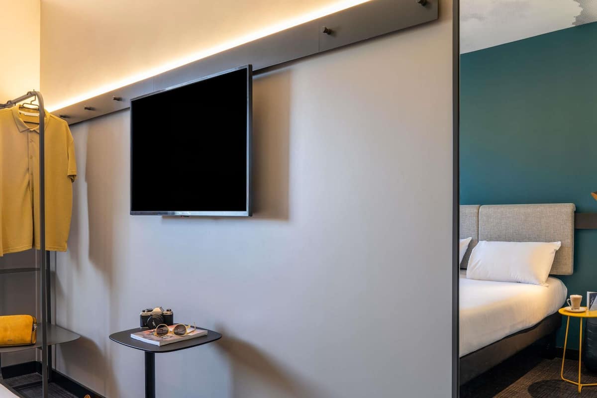 Hypo-allergenic bedding, down duvets, desk, laptop workspace