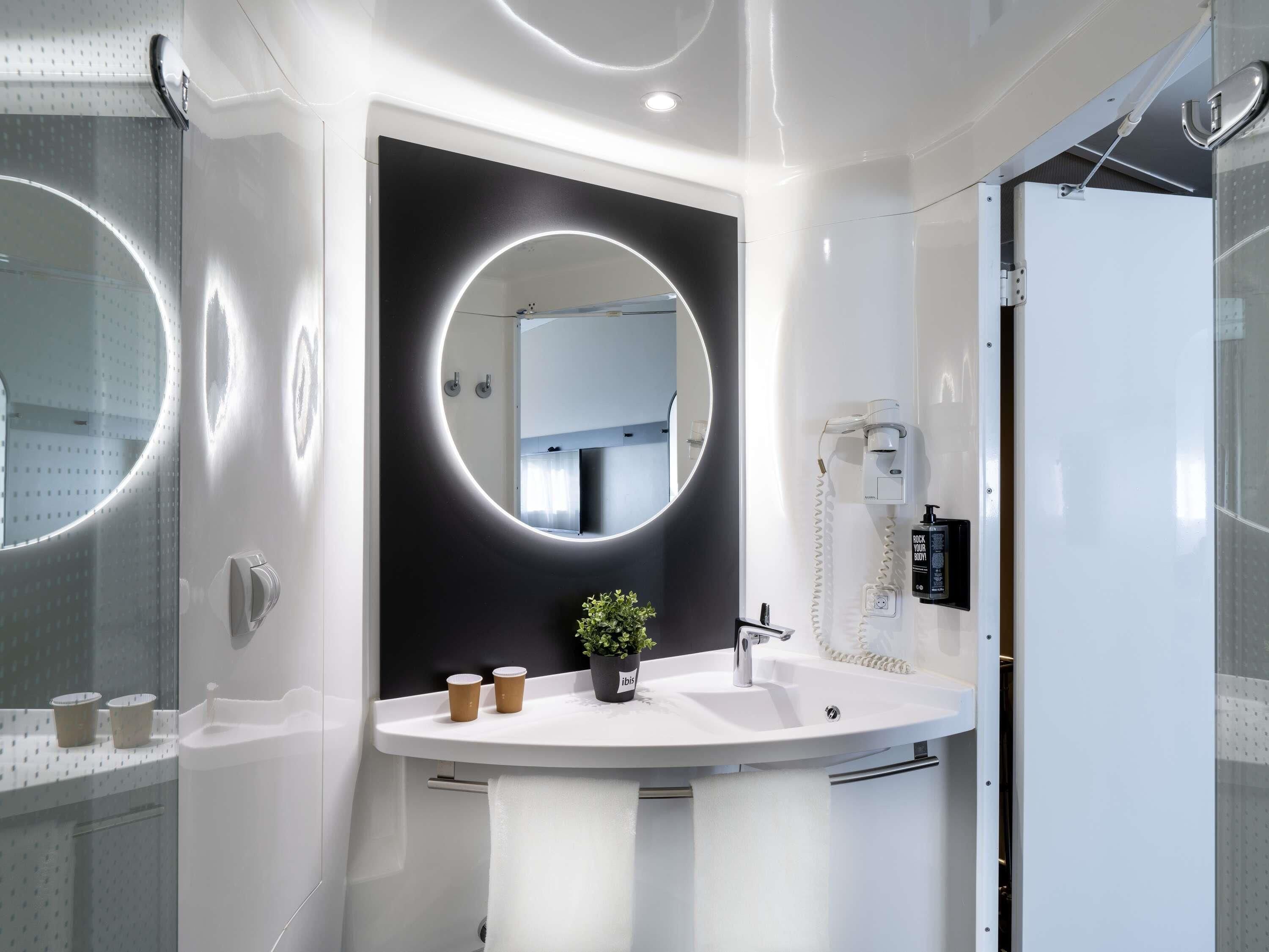 Hypo-allergenic bedding, down duvets, desk, laptop workspace