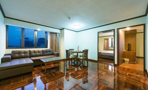 Two Bedroom Suite | Living room | TV - Omni Tower Sukhumvit Nana by Compass Hospitality (Bangkok)