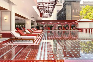 A pool area with sun loungers and a tiled floor. - Blue Cabin Hotel (Formerly A-ONE New Wing Hotel) (Pattaya)
