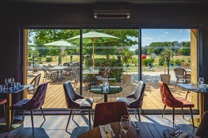 Lunch, dinner served; French cuisine, golf course views 