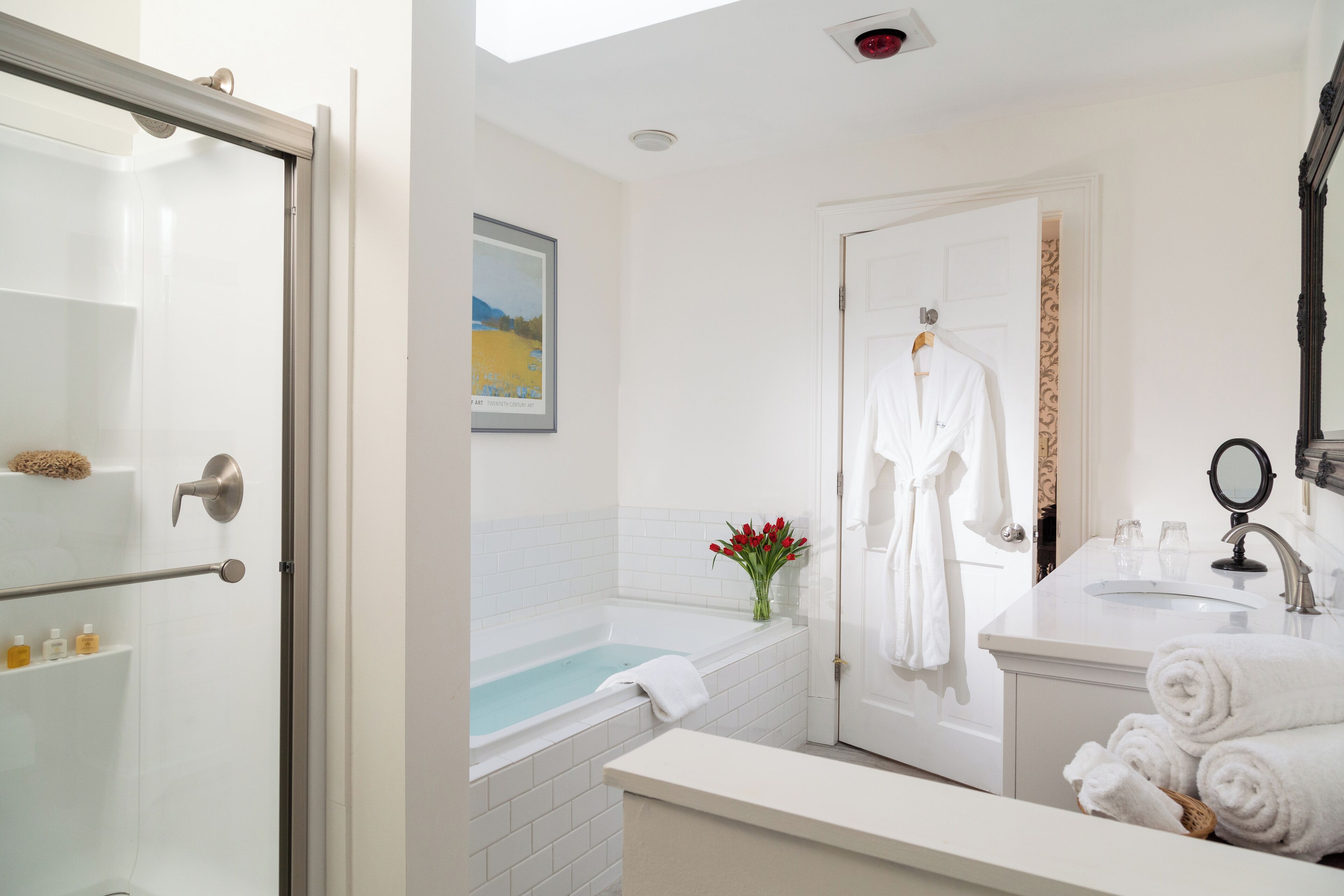 King Whirlpool Fireplace Room with Private Deck | Bathroom | Combined shower/bathtub, designer toiletries, hair dryer, bathrobes