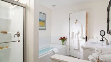 King Whirlpool Fireplace Room with Private Deck | Bathroom | Combined shower/bathtub, designer toiletries, hair dryer, bathrobes