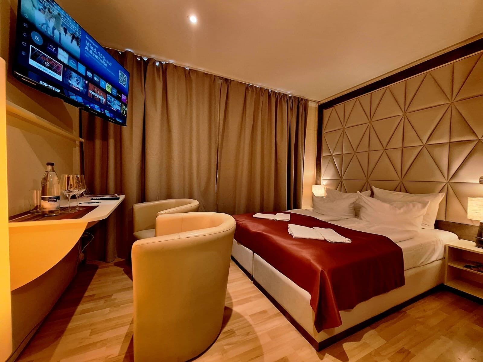 Hypo-allergenic bedding, down duvets, pillow-top beds, in-room safe