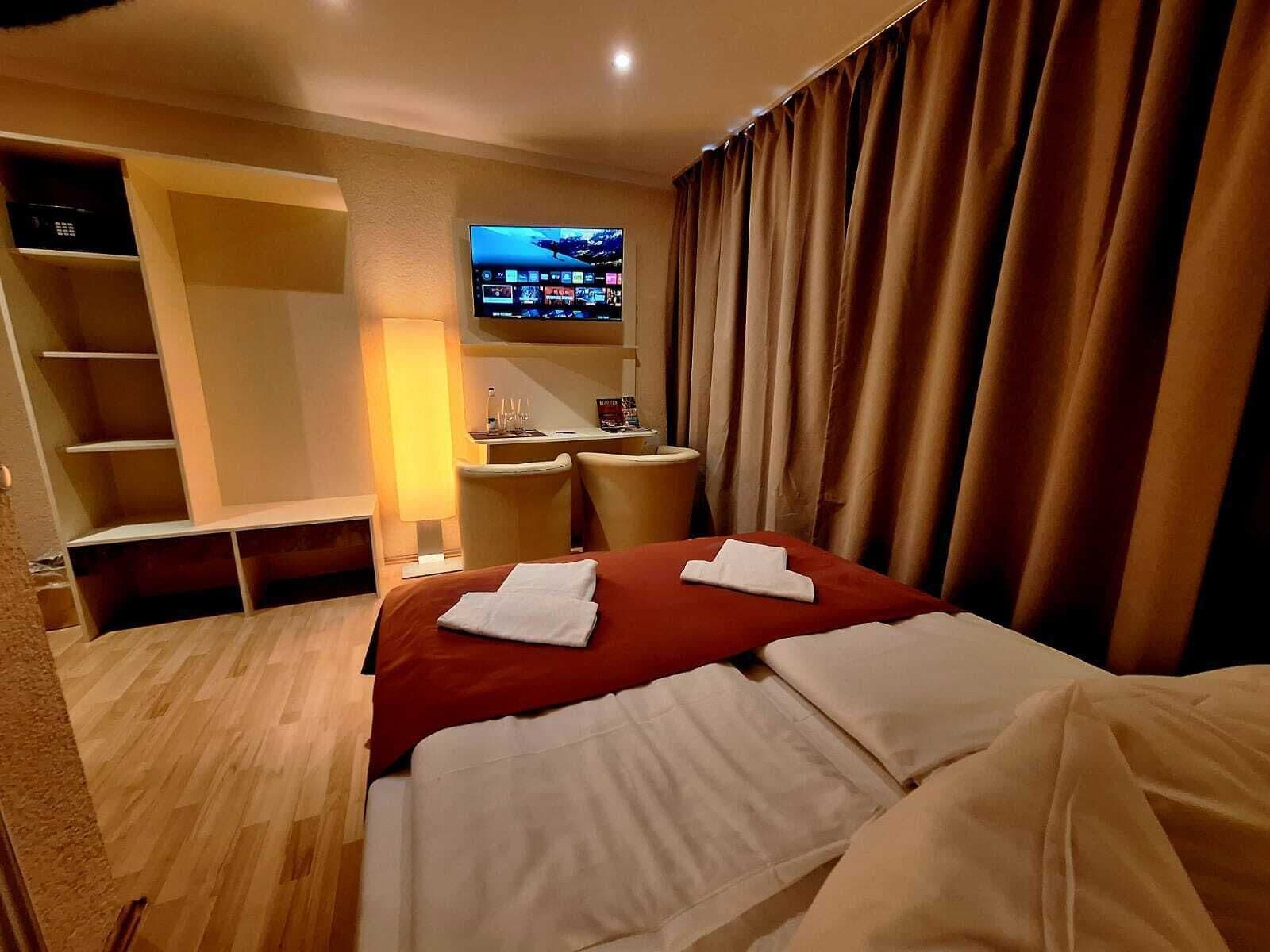 Hypo-allergenic bedding, down duvets, pillow-top beds, in-room safe