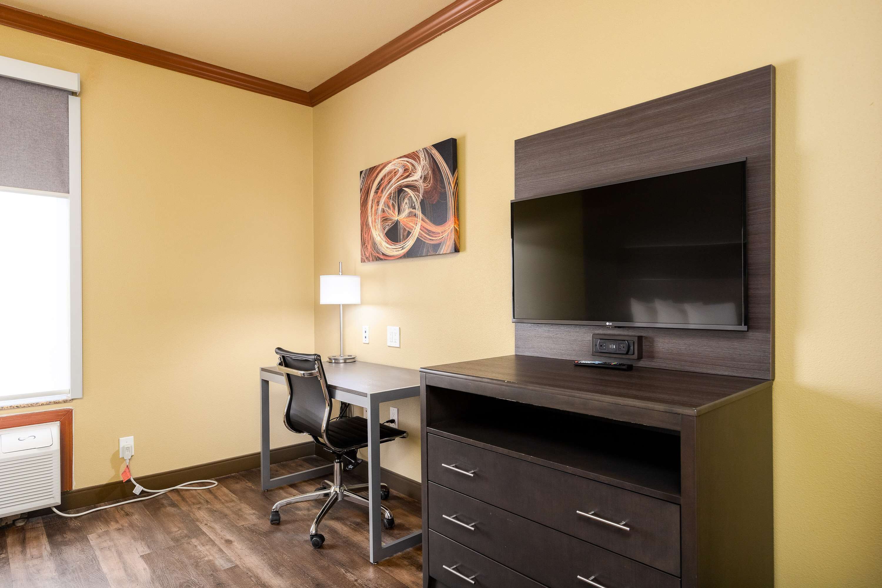 desk, laptop workspace, iron/ironing board, rollaway beds