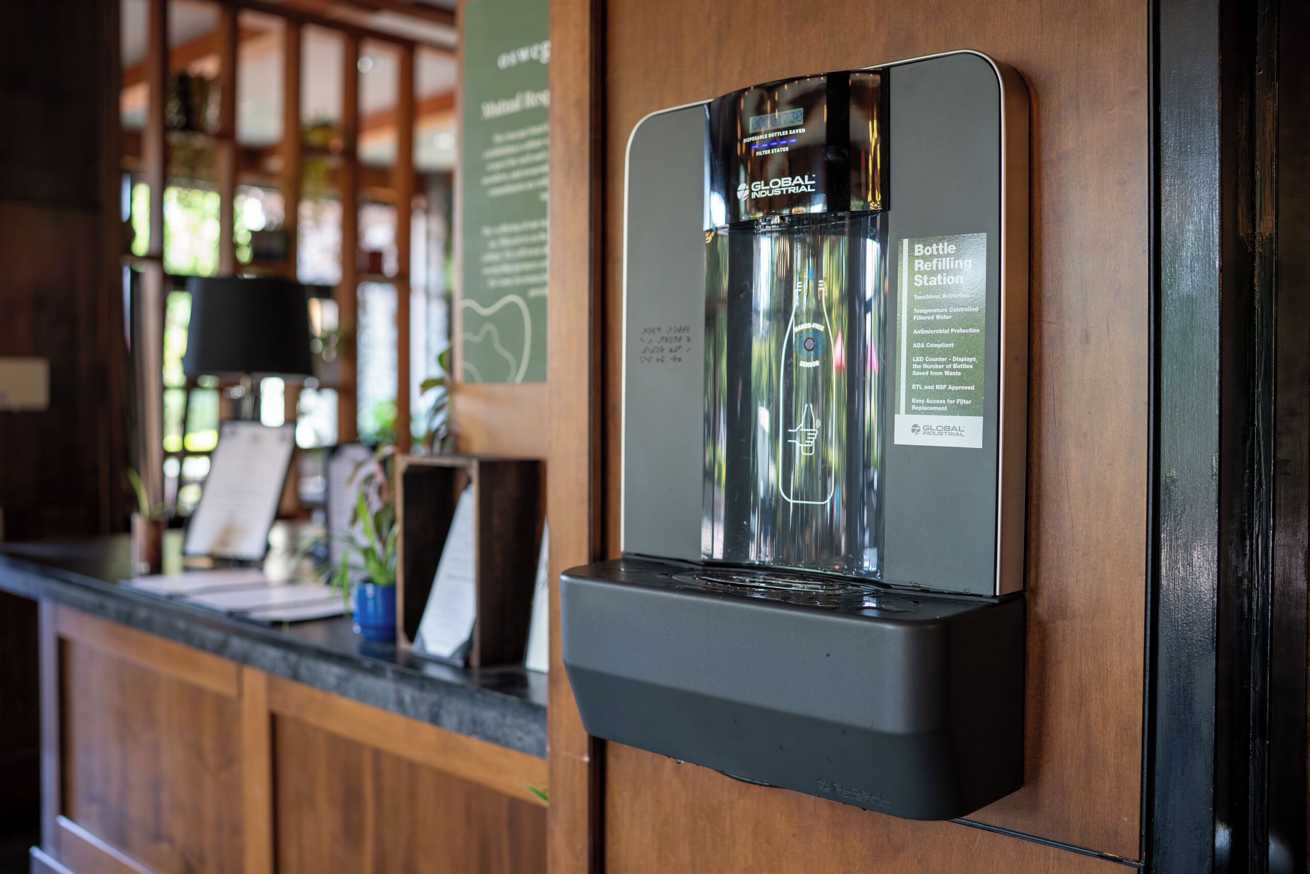 A bottle refilling station with a label indicating it is a GLOBAL INDUSTRIAL product.