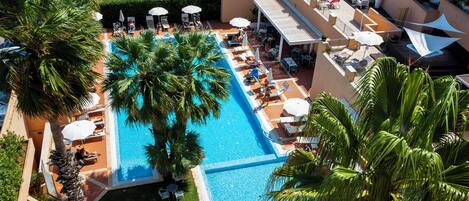 Outdoor pool, open 9:00 AM to 7:00 PM, free pool cabanas, pool umbrellas