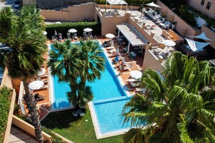 Outdoor pool, open 9:00 AM to 7:00 PM, free pool cabanas, pool umbrellas