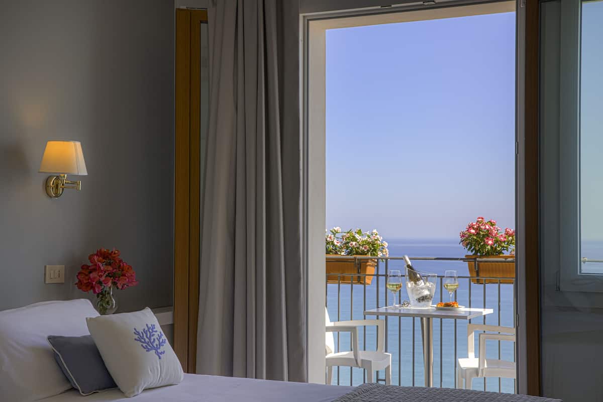 superior triple room, sea view | down duvets, minibar, in-room safe, desk