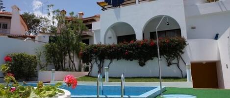 Outdoor pool, open 7:00 AM to 10:00 PM, pool umbrellas, pool loungers