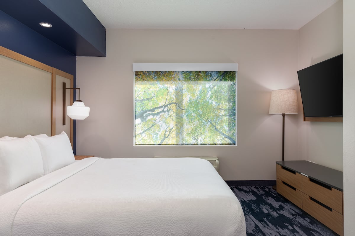 Premium bedding, desk, laptop workspace, iron/ironing board